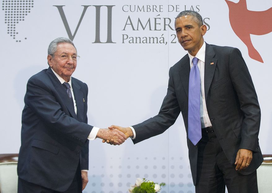 President Obama and Cuban President Raul Castro shake hands during their meeting at the Summit of the Americas in Panama City, Panama, in this April 11, 2015, file photo. (Associated Press) ** FILE **