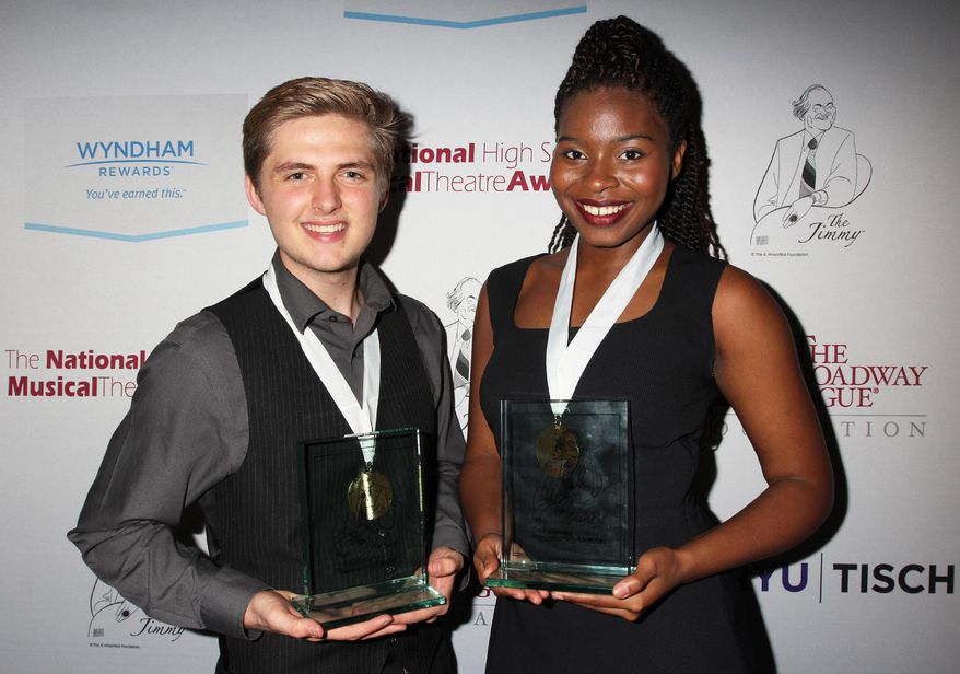 In this June 29, 2015 photo released by The Broadway League Inc., Anthony Skillman, of Tustin, Calif., left, and Marla Louissaint, of New York, pose with their National High School Musical Theater Awards for best actor and actress in New York. Louissaint sang “I’m Here” from “The Color Purple” for her solo _ a song that helped convince her parents to let her sing and act and Skillman sang “It Don’t Make Sense” from Jason Robert Brown’s musical “Parade.” (Henry McGee/The Broadway League Inc. via AP)