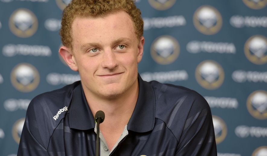 Jack Eichel pauses as he listens to a reporter during a press conference at the First Niagara Center Wednesday July 1, 2015, in Buffalo, N.Y. Eichel signed an NHL three-year, entry-level contract with the Buffalo Sabres.  (AP Photo/Gary Wiepert)