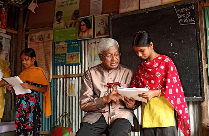 This Sept. 4, 2012 provided by the Bangladesh Rural Advancement Committee shows Sir Fazle Hasan Abed during a visit to the BRAC School in the Karail slum in Dhaka, Bangladesh. Abed, who created BRAC, a nonprofit organization credited with helping more than 150 million people out of poverty, was chosen Wednesday, July 1, 2015 as this year’s recipient of the World Food Prize. (Bangladesh Rural Advancement Committee via AP)