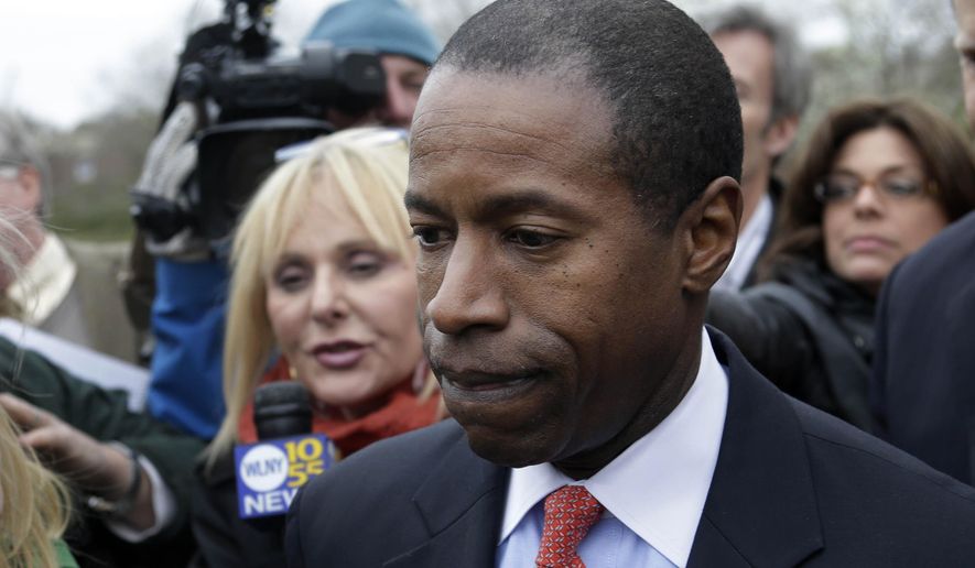 FILE - In this April 23, 2013, file photo, New York State Sen. Malcolm Smith is surrounded by media as he leaves federal court in White Plains, N.Y. Federal prosecutors are asking that the former Democratic state senator be sentenced to up to 10 years in prison after he was found guilty earlier this year in a scheme to bribe his way onto the ballot for the 2013 New York City mayoral election. Smith is scheduled to be sentenced Wednesday, July 1, 2015, in federal court in White Plains. (AP Photo/Seth Wenig, File)