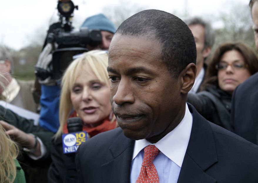 FILE - In this April 23, 2013, file photo, New York State Sen. Malcolm Smith is surrounded by media as he leaves federal court in White Plains, N.Y. Federal prosecutors are asking that the former Democratic state senator be sentenced to up to 10 years in prison after he was found guilty earlier this year in a scheme to bribe his way onto the ballot for the 2013 New York City mayoral election. Smith is scheduled to be sentenced Wednesday, July 1, 2015, in federal court in White Plains. (AP Photo/Seth Wenig, File)