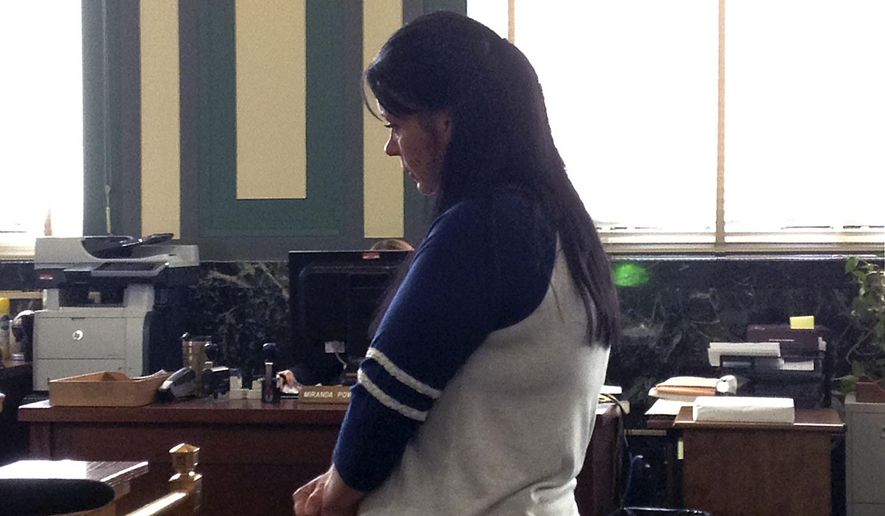 Candida Fluty, appears in Hamilton County Common Pleas Court, Wednesday, July 1, 2015 in Cincinnati. Fluty, a West Virginia woman accused of deliberately making her 9-year-old son sick by contaminating his IV at a Cincinnati hospital pleaded guilty Wednesday to a charge of child endangering and was sentenced to six years in prison. (Kevin Grasha/The Cincinnati Enquirer via AP) MANDATORY CREDIT; NO SALES
