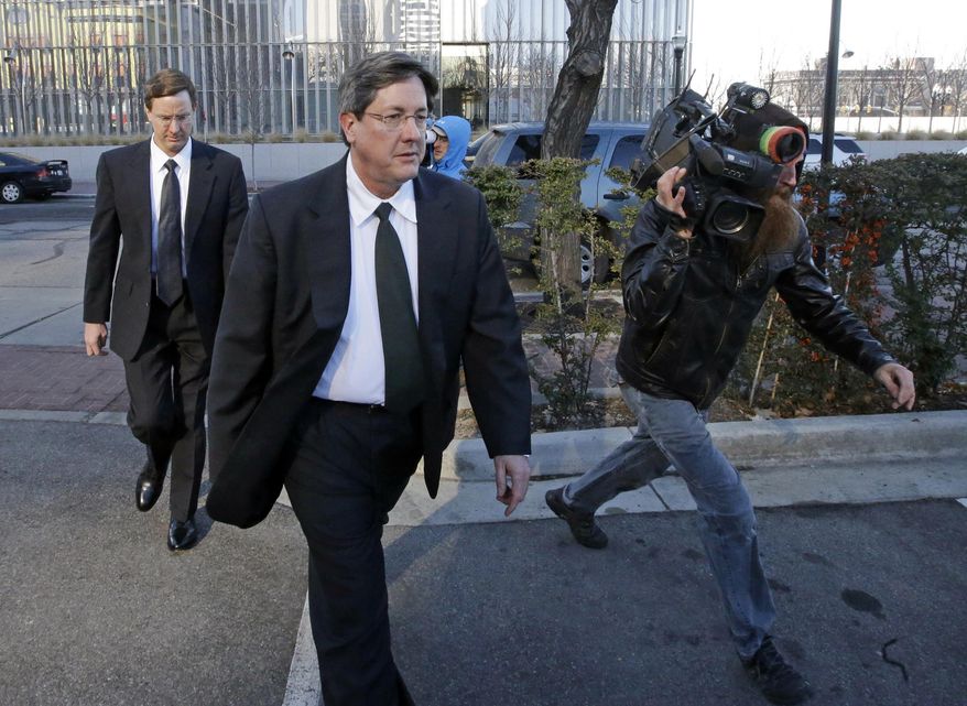 FILE - This Jan. 21, 2015 file photo, brothers of polygamous sect leader Warren Jeffs, Lyle, foreground, and Nephi, leave the federal courthouse in Salt Lake City. An estranged wife of polygamist leader Lyle Jeffs plans to testify against the Fundamentalist Church of Jesus Christ of Latter-Day Saints and two polygamist towns on the Utah-Arizona line. The Salt Lake Tribune reports that Charlene Jeffs will testify in the U.S. Department of Justice lawsuit against Hildale, Utah and Colorado City, Arizona. (AP Photo/Rick Bowmer, File)