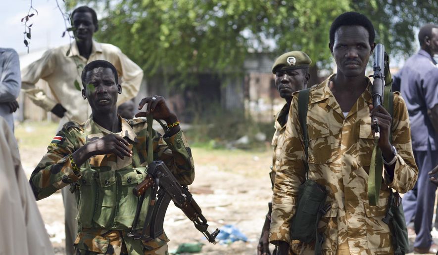 In this photo taken Wednesday, June 24, 2015, South Sudanese government soldiers patrol in Bentiu town, South Sudan. (AP Photo/Jason Patinkin) ** FILE **