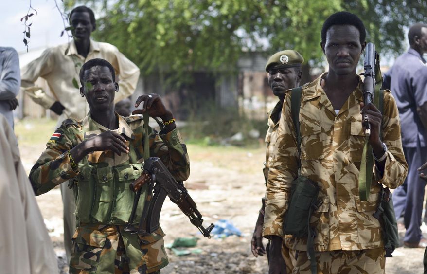In this photo taken Wednesday, June 24, 2015, South Sudanese government soldiers patrol in Bentiu town, South Sudan. (AP Photo/Jason Patinkin) ** FILE **