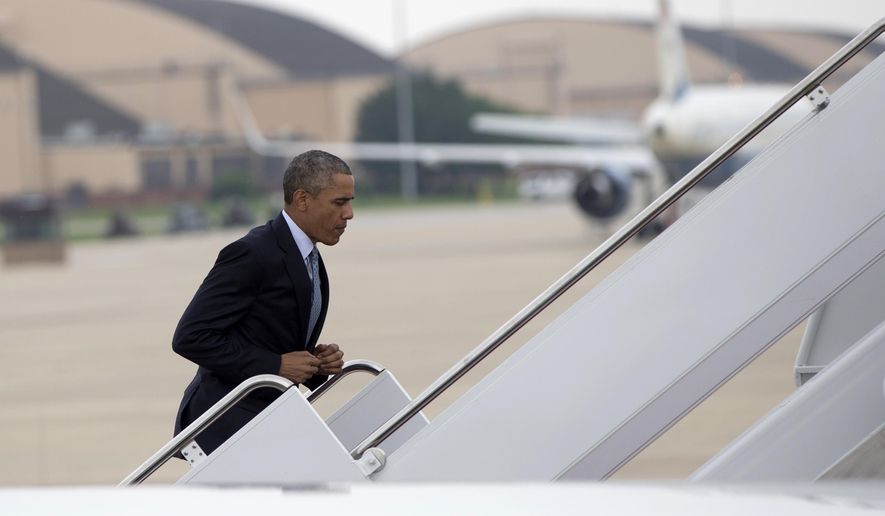 President Barack Obama runs up the stairs to board Air Force One, Thursday, July 2, 2015, at Andrews Air Force Base, Md., en route to La Crosse, Wis., where he is to speak at the University of Wisconsin at La Crosse about economy and to promote a proposed Labor Department rule that would make more workers eligible for overtime. (AP Photo/Carolyn Kaster)