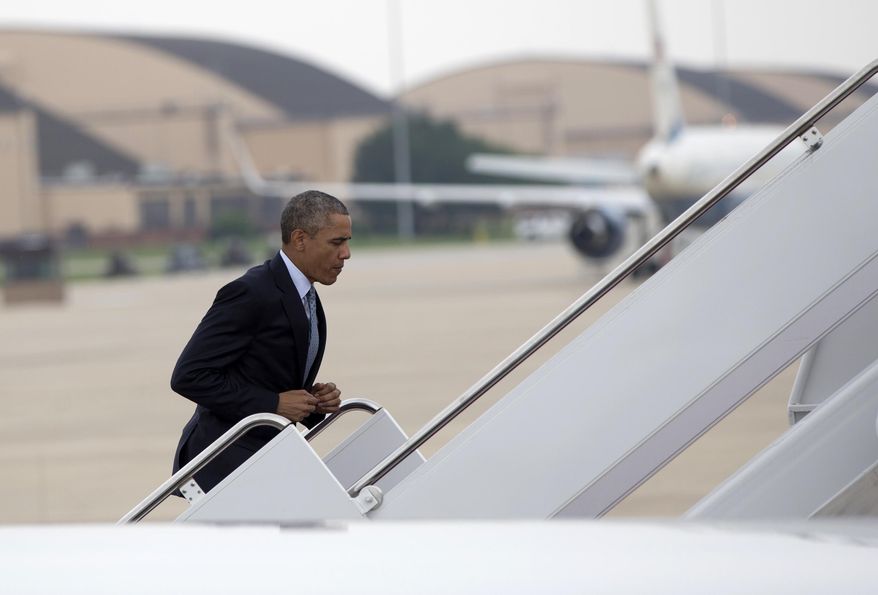 President Barack Obama runs up the stairs to board Air Force One, Thursday, July 2, 2015, at Andrews Air Force Base, Md., en route to La Crosse, Wis., where he is to speak at the University of Wisconsin at La Crosse about economy and to promote a proposed Labor Department rule that would make more workers eligible for overtime. (AP Photo/Carolyn Kaster)