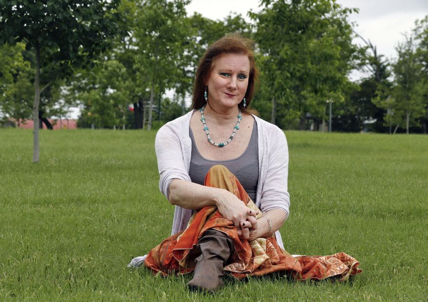 ADVANCE FOR WEEKEND EDITIONS JULY 4-5 - In this May 14, 2015 photo, Nell Gaither, president of Trans Pride Initiative, poses for a portrait in Kiest Park in Dallas. “When health care really stresses biology, it leaves a large portion of us out,” Nell Gaither, president of the Trans Pride Initiative, a local advocacy group, told The Dallas Morning News. (Nathan Hunsinger/The Dallas Morning News via AP) MANDATORY CREDIT; MAGS OUT; TV OUT; INTERNET USE BY AP MEMBERS ONLY; NO SALES