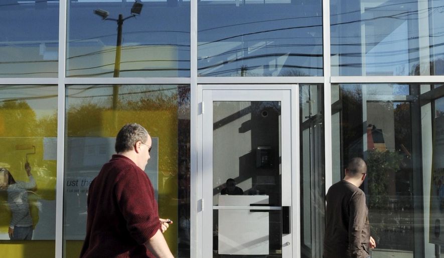 FILE - In this photo Oct. 26, 2009 file photo, customers enter a Sprint store in Saugus, Mass. Sprint is introducing an "all-in" pricing plan, meaning a single, $80-a-month price that includes both a smartphone and a service plan for voice, text and unlimited data. (AP Photo/Lisa Poole, File)