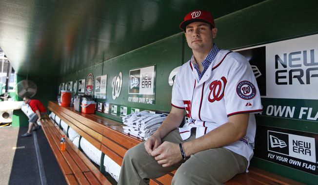 Washington Nationals pitcher Lucas Giolito sits in the dugout before the Nationals&#x27; baseball game with the New York Mets on Tuesday, July 17, 2012, in Washington. Giolito was the team&#x27;s top pick in this year&#x27;s draft. (AP Photo/Alex Brandon)