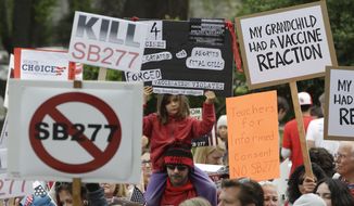 Protesters against a measure requiring California schoolchildren to get vaccinated rally at the Capitol in Sacramento on April 8. (Associated Press)
