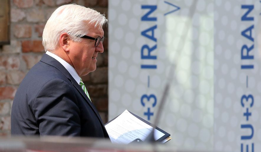 German Foreign Minister Frank-Walter Steinmeier leaves Palais Coburg where closed-door nuclear talks with Iran take place in Vienna, Austria, Thursday, July 2, 2015. (AP Photo/Ronald Zak)