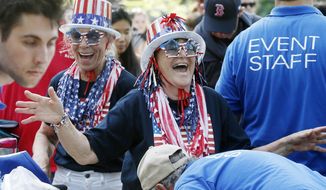 July Fourth revelers are encouraged to enjoy their celebrations but are told to expect heightened security. (Associated Press/File)