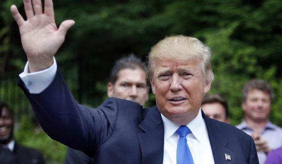 In this June 30, 2015, photo, Republican presidential candidate Donald Trump waves as he arrives at a house party in Bedford, N.H. Hispanic leaders are warning of harm to Republican White House hopes unless the party’s presidential contenders do more to condemn Trump, who’s refusing to apologize for calling Mexican immigrants rapists and drug dealers.  (AP Photo/Jim Cole)