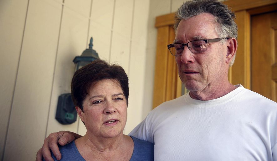 Liz Sullivan (left) and Jim Steinle, parents of Kathryn Steinle, talk to members of the media outside their home in Pleasanton, Calif., on July 2, 2015. Kathryn Steinle was shot to death, apparently at random, while walking with her father and a friend along a popular pedestrian pier on the San Francisco waterfront on July 1. The woman was shot Wednesday evening at Pier 14 and died at a hospital. (Lea Suzuki/San Francisco Chronicle via Associated Press)