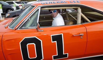 In this Feb. 1, 2012, file photo, golfer Bubba Watson drives off in the General Lee after playing in the pro-am at the Phoenix Open golf tournament in Scottsdale, Ariz. Bubba Watson says he&#x27;s painting over the Confederate flag on his car made popular in &amp;quot;The Dukes of Hazzard&amp;quot; television series. Watson said Friday, July 3, 2015, he&#x27;ll replace it with the U.S. flag on the roof of the &amp;quot;General Lee 01.&amp;quot; (AP Photo/The Arizona Republic, Rob Schumacher, File)