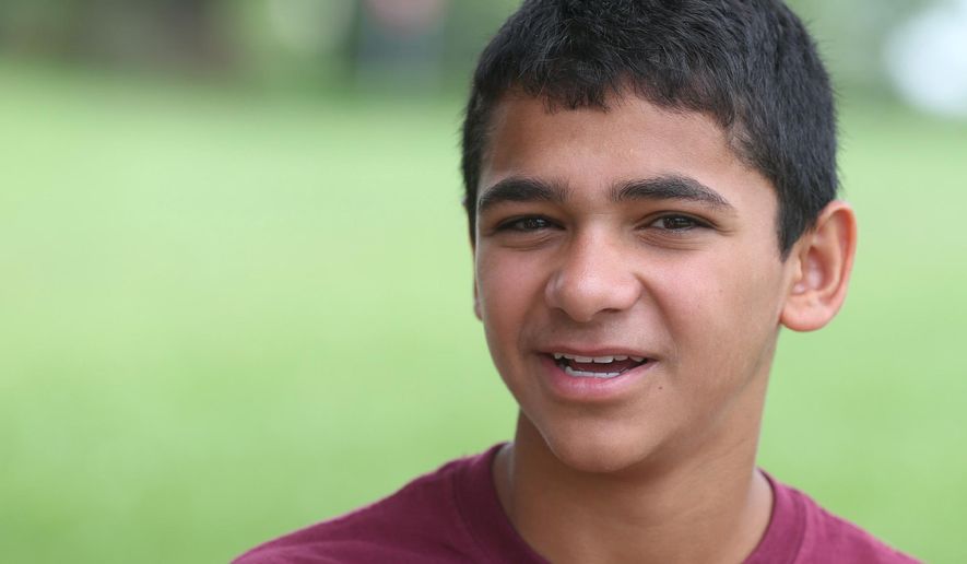 ADVANCE FOR RELEASE FRIDAY, JULY 3, 2015, AND THEREAFTER- In this June 23, 2015 photo, John Handley High School sophomore Joseph Rosenfeld, poses for a photo at the school in Winchester, Va. Rosenfeld discovered a decades-old math error that had gone unnoticed at the Museum of Science in Boston during a visit in June. (Jeff Taylor/The Winchester Star via AP) MANDATORY CREDIT
