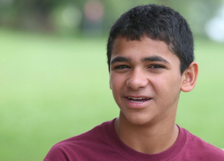 ADVANCE FOR RELEASE FRIDAY, JULY 3, 2015, AND THEREAFTER- In this June 23, 2015 photo, John Handley High School sophomore Joseph Rosenfeld, poses for a photo at the school in Winchester, Va. Rosenfeld discovered a decades-old math error that had gone unnoticed at the Museum of Science in Boston during a visit in June. (Jeff Taylor/The Winchester Star via AP) MANDATORY CREDIT