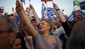 Demonstrators shout slogans during a rally organized by supporters of the Yes vote in Athens, Friday, July 3, 2015. A new opinion poll shows a dead heat in Greece&#39;s referendum campaign with just two days to go before Sunday&#39;s vote on whether Greeks should accept more austerity in return for bailout loans. (AP Photo/Emilio Morenatti)