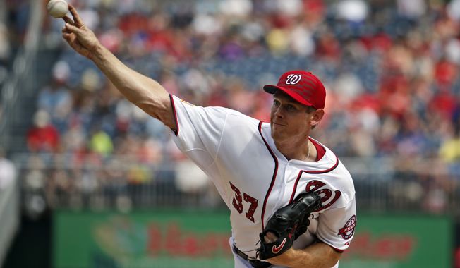 Washington Nationals starting pitcher Stephen Strasburg (37) throws during the first inning of a baseball game against the San Francisco Giants at Nationals Park, Saturday, July 4, 2015, in Washington. (AP Photo/Alex Brandon)