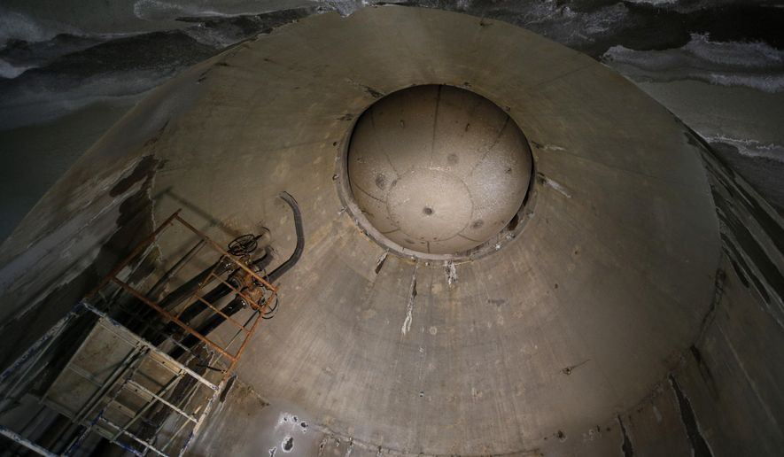 In this June 1, 2015 photo, a steel cap on top of a water intake riser holds back the water of Lake Mead in a tunnel still under construction near Boulder City, Nev. When operational, the three-mile-long tunnel and intake will allow the Southern Nevada Water Authority to draw water from Lake Mead even if its water level falls below the two current intakes. (AP Photo/John Locher)