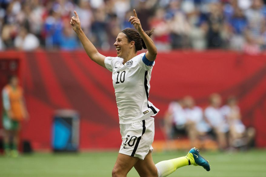 United States&#x27; Carli Lloyd (10) celebrates her third goal against Japan during first half action in the FIFA Women&#x27;s World Cup soccer championship in Vancouver, British Columbia, Canada, Sunday, July 5, 2015.   (Jonathan Hayward/The Canadian Press via AP) MANDATORY CREDIT
