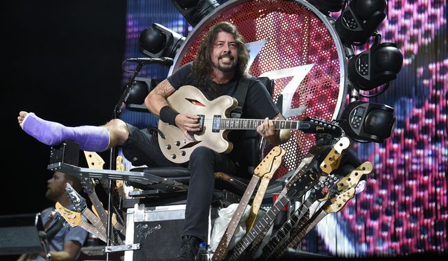 The Foo Fighters&#x27; Dave Grohl performs at RFK Stadium on Saturday, July 4, 2015, in Washington. (Photo by Nick Wass/Invision/AP) ** FILE **