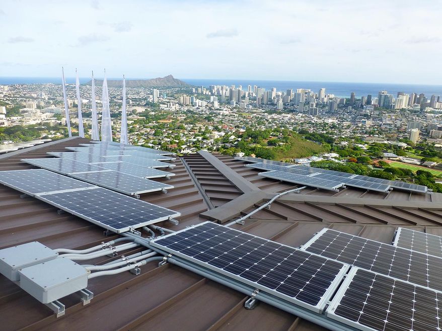 In this undated photo provided by Blue Planet Energy Systems, LLC, PV panels are on Henk Rogers' home in Honolulu. Rogers hopes the technology he is using in his home can help make other homes across Hawaii, and the world, energy independent as well. (Ryno Irwin/Blue Planet Energy Systems, LLC via AP)