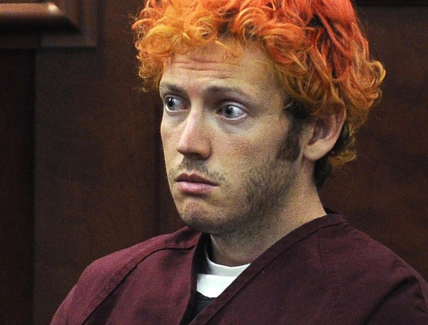 FILE - In this July 23, 2012, file photo, James Holmes, who is charged with killing 12 moviegoers and wounding 70 more in a shooting spree in a crowded theatre in 2012, sits in Arapahoe County District Court in Centennial, Colo. The relationship Arlene and Robert Holmes had with their son James had been strained since he was a young boy. After he left for graduate school, their communication was mostly confined to terse emails. Holmes told a psychiatrist years after his gunshots killed 12 people and injured 70 in a crowded Colorado movie theater that he doesn’t like to talk with people, even his mother and father. (RJ Sangosti/The Denver Post via AP, Pool, File)