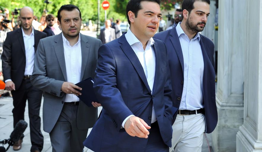 Greek Prime Minister Alexis Tsipras, center, arrives to attend a meeting with Greek political party leaders at the Presidential Palace as Minister of State Nikos Pappas, left, and Government spokesman Gabriel Sakellaridis, right, follow him in Athens, Monday, July 6, 2015. Greek Finance Minister Yanis Varoufakis resigned Monday, saying he was told shortly after Greece's decisive referendum result that some other eurozone finance ministers and the country's other creditors would appreciate his not attending the ministers' meetings.(Giannis Kotsiaris/InTime News via AP) GREECE OUT