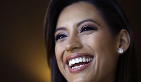 In this Monday, July 6, 2015 photo, Miss California Natasha Martinez speaks during an interview after rehearsals for the upcoming Miss USA Pageant in Baton Rouge, La. Pageant co-owner Donald Trump recently made comments painting Mexican immigrants as criminals. (AP Photo/Gerald Herbert)
