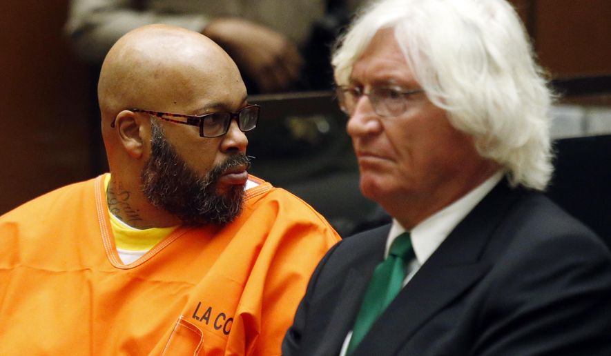 CORRECTS SUBJECT OF HEARING TO MURDER CHARGES INSTEAD OF ROBBERY CHARGES - Marion Hugh "Suge" Knight looks toward the gallery as he sits with his attorney Thomas Mesereau in Los Angeles Superior Court Tuesday, July 7, 2015. Judge Stephen Marcus rejected a motion by Mesereau to dismiss the case against Knight because a key witness refused to identify the Death Row Records co-founder as the person who ran him over. Marcus disagreed, ruling that Knight should stand trial for murder, saying there was no dispute that Knight was behind the wheel of his pickup when he ran over Cle "Bone" Sloan and another man outside a Compton burger stand in late January. Knight was also in court on Tuesday for a hearing in an unrelated robbery case, in which another judge set a Sept. 17 date for a preliminary hearing. (Patrick T. Fallon/Pool Photo via AP)