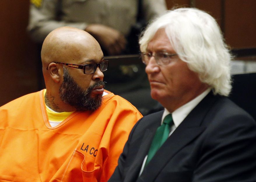 CORRECTS SUBJECT OF HEARING TO MURDER CHARGES INSTEAD OF ROBBERY CHARGES - Marion Hugh "Suge" Knight looks toward the gallery as he sits with his attorney Thomas Mesereau in Los Angeles Superior Court Tuesday, July 7, 2015. Judge Stephen Marcus rejected a motion by Mesereau to dismiss the case against Knight because a key witness refused to identify the Death Row Records co-founder as the person who ran him over. Marcus disagreed, ruling that Knight should stand trial for murder, saying there was no dispute that Knight was behind the wheel of his pickup when he ran over Cle "Bone" Sloan and another man outside a Compton burger stand in late January. Knight was also in court on Tuesday for a hearing in an unrelated robbery case, in which another judge set a Sept. 17 date for a preliminary hearing. (Patrick T. Fallon/Pool Photo via AP)