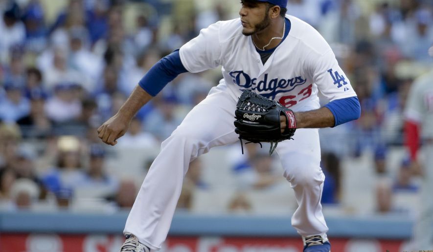 Los Angeles Dodgers starting pitcher Yimi Garcia throws against the Philadelphia Phillies during the first inning of a baseball game in Los Angeles, Monday, July 6, 2015. (AP Photo/Chris Carlson)