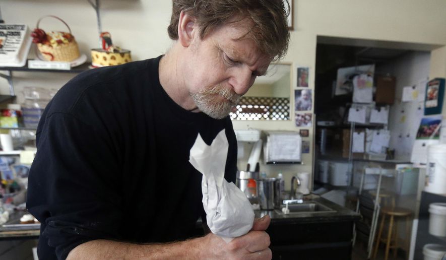 Masterpiece Cakeshop owner Jack Phillips decorates a cake inside his store in Lakewood, Colo., on March 10, 2014. Phillips, who refused to make a wedding cake for a gay couple, argued that his religious beliefs should protect him from sanctions against his business. (Associated Press) **FILE**