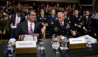 Chairman of the Joint Chiefs of Staff, Gen. Martin Dempsey and Defense Secretary Ash Carter take their seats as they arrive at the Senate Armed Services Committee hearing on Capitol Hill in Washington, Tuesday, July 7, about Counter-ISIL (Islamic State of Iraq and the Levant) Strategy. Carter and Dempsey face questions from members of the Senate panel about President Barack Obama&#x27;s strategy to defeat Islamic State militants. (AP Photo/Carolyn Kaster)