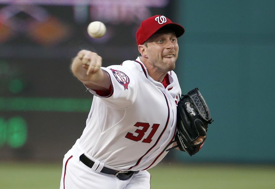 Washington Nationals starting pitcher Max Scherzer throws during the third inning of a baseball game against the Cincinnati Reds at Nationals Park, Tuesday, July 7, 2015, in Washington. (AP Photo/Alex Brandon)