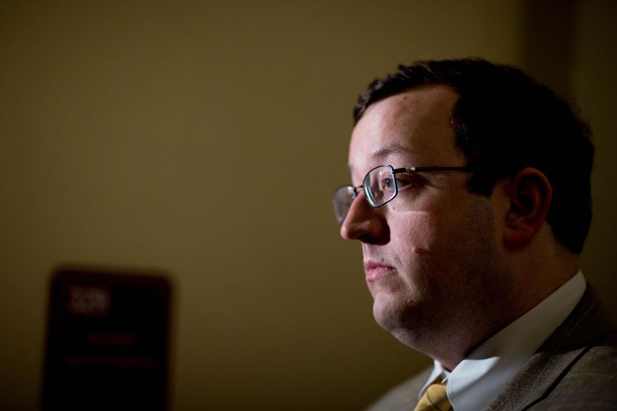 FILE- In this April 2, 2015 file photo, Georgia Sen. Josh McKoon, R - Columbus, speaks to the media on the final day of the 2015 legislative session in Atlanta. McKoon says law enforcement agencies should be sanctioned for not cooperating with federal requests to keep people in the country illegally in jail. McKoon says he may propose financial penalties for those agencies that refuse to hold people or incentives for those that honor the requests. He still is developing a proposal for the next legislative session. The fatal shooting of a woman in San Francisco has renewed scrutiny on cities and counties that don’t fully cooperate with immigration authorities. A Mexican man in the U.S. illegally has been charged in her death. (AP Photo/Branden Camp, File)