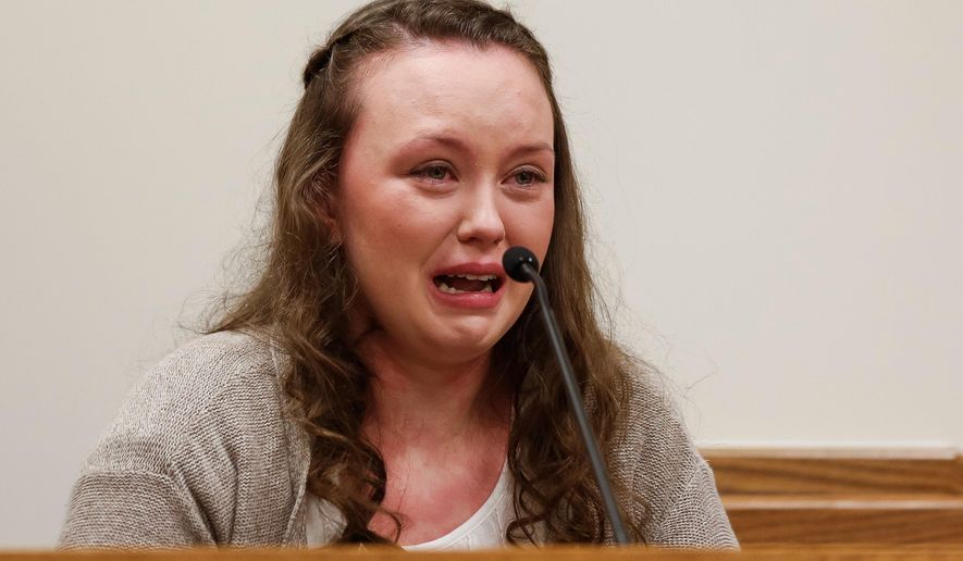 FILE - In this May 7, 2015, file photo, Meagan Grunwald testifies while being questioned by her defense attorney Dean Zabriskie during her trial in Provo, Utah. Grunwald, a Utah teenager convicted in a 50-mile crime spree that left one sheriff's deputy dead and another wounded, is scheduled to be sentenced Wednesday afternoon, July 8, 2015. Grunwald, 18, faces 25 years to life in prison following her May conviction of 11 charges, including aggravated murder. (Spenser Heaps/The Daily Herald via AP, Pool, File)