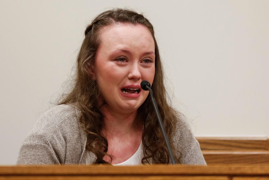 FILE - In this May 7, 2015, file photo, Meagan Grunwald testifies while being questioned by her defense attorney Dean Zabriskie during her trial in Provo, Utah. Grunwald, a Utah teenager convicted in a 50-mile crime spree that left one sheriff's deputy dead and another wounded, is scheduled to be sentenced Wednesday afternoon, July 8, 2015. Grunwald, 18, faces 25 years to life in prison following her May conviction of 11 charges, including aggravated murder. (Spenser Heaps/The Daily Herald via AP, Pool, File)