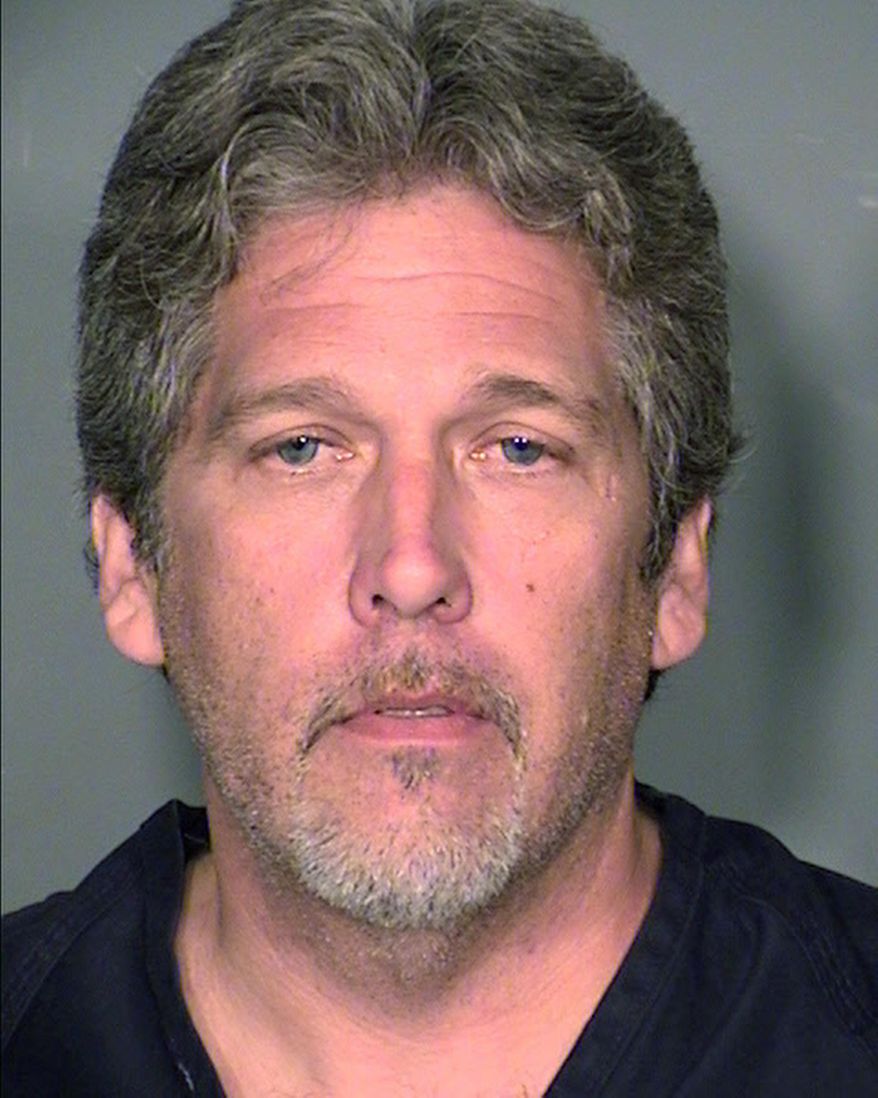 This May 8, 2015 photo provided by the Las Vegas Metropolitan Police Department shows James Stapleton, 46, of Las Vegas. Stapleton pleaded not guilty Wednesday, July 8, 2015, in Clark County District to felony murder and firing a weapon into a vehicle charges in the fatal shooting May 7, 2015, of Giancarlo John Banova, 60. (Clark County Detention Center via AP)