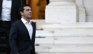 Greece&#39;s Prime Minister Alexis Tsipras leaves from Maximos Mansion to meet the Greek President Prokopis Pavlopoulos in Athens, Wednesday, July 8, 2015. (AP Photo/Petros Karadjias)