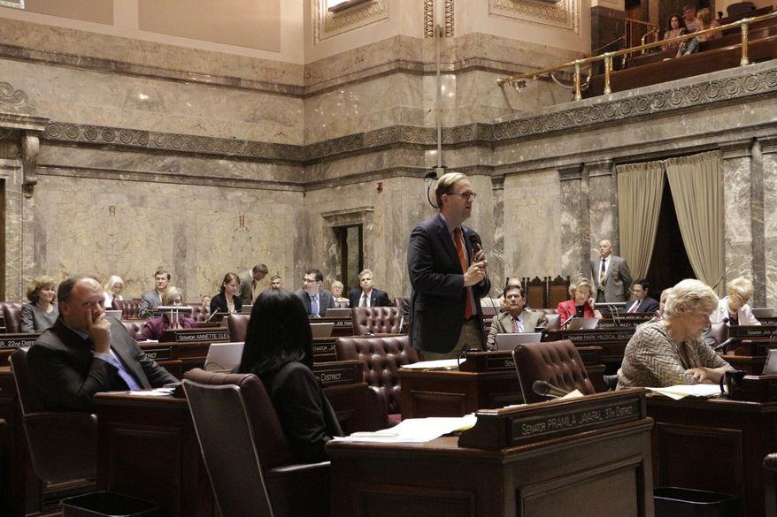 Democatic Sen. Marko Liias speaks against a measure that would delay full implementation of an initiative to reduce class sizes, Thursday, July 9, 2015, in Olympia, Wash. The measure was a key component to the state's new $38.2 billion operating budget. (AP Photo/Rachel La Corte)