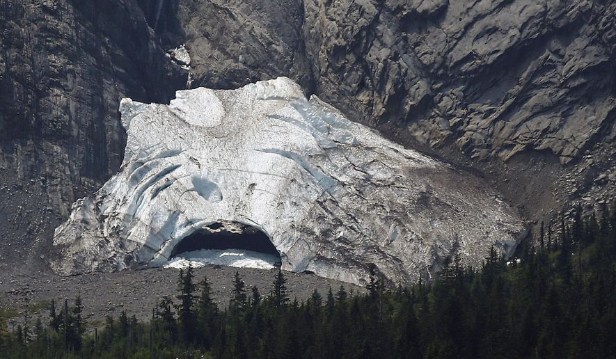 The Big Four Ice Caves in Washington are devoid of visitors Tuesday, July 7, 2015. On Tuesday, crews were trying to recover the body of a 34-year-old woman buried when rock and ice fell at the back of the cave. The ice caves area is prone to avalanches, falling rocks and ice, and visitors are urged not to leave the trail or enter the caves. (Mark Mulligan/The Herald via AP) MANDATORY CREDIT