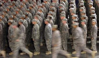 In this Sept. 22, 2009, file photo, members of the U.S. Army&#39;s 1st Infantry Division fall in for a re-deployment ceremony upon return from Iraq to Fort Riley, Kan. (AP Photo/Orlin Wagner, File)