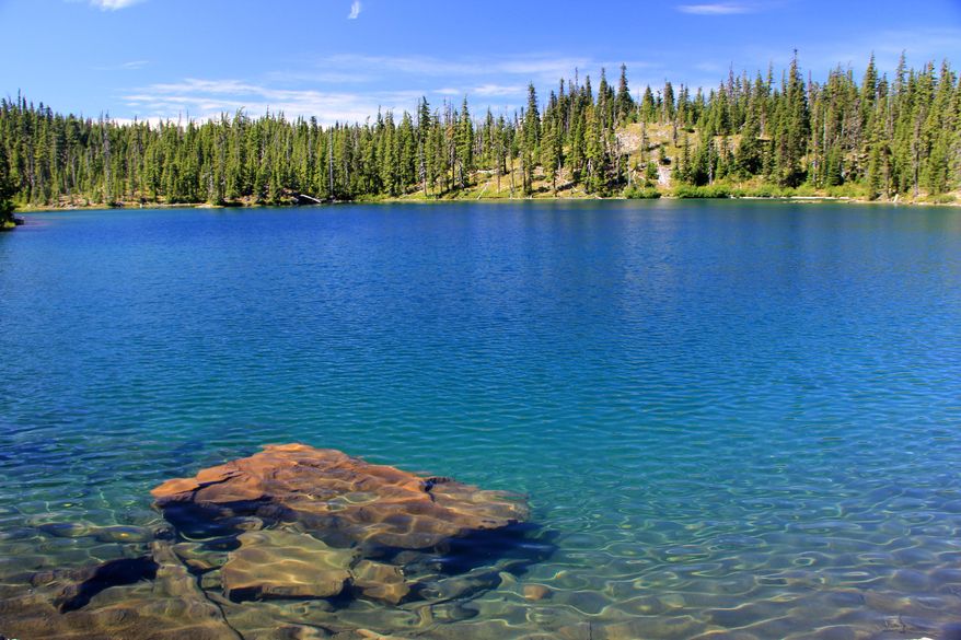 This undated photo shows the water of Gifford Lake at the Olallie Lake Scenic Area in Mount Hood National Forest, Oregon. A family of six hiking in Mount Hood National Forest got stranded and were rescued Wednesday after waiting in snowy conditions overnight. (Zach Urness/Statesman-Journal via AP, file)
