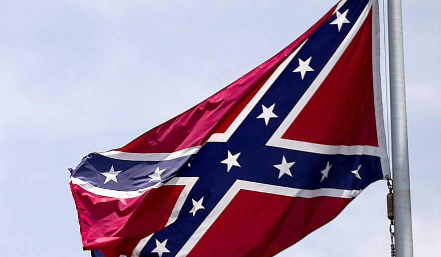 A Confederate flag flies at the base of Stone Mountain in Stone Mountain, Ga. (AP Photo/David Goldman, File)