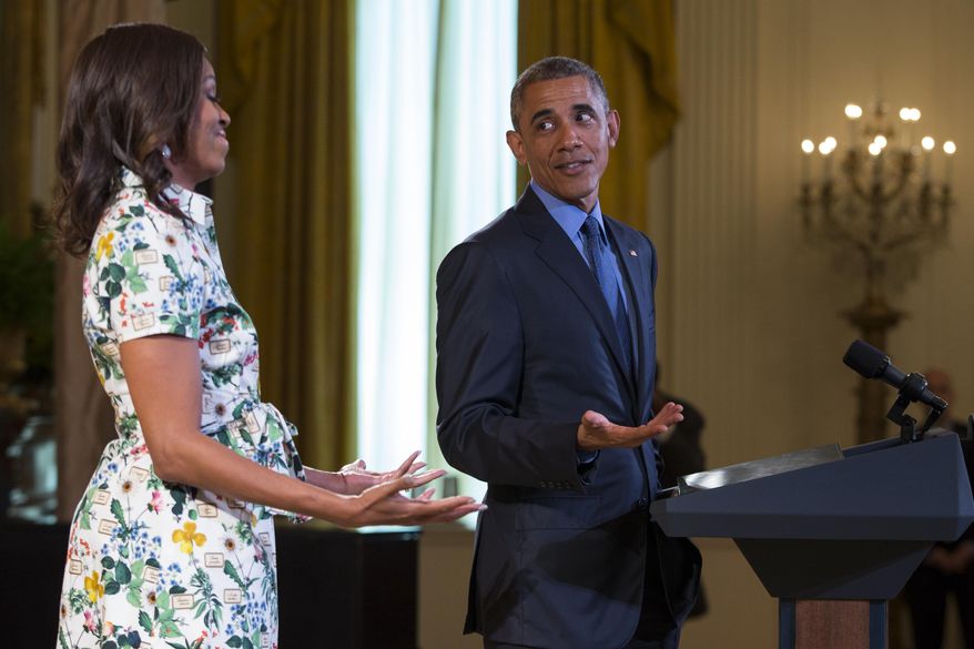President Barack Obama, right, jokes with first lady Michelle Obama as he speaks during the Kids State Dinner for the 2015 winners of the Healthy Lunchtime Challenge, on Friday, July 10, 2015, in Washington. (AP Photo/Evan Vucci)