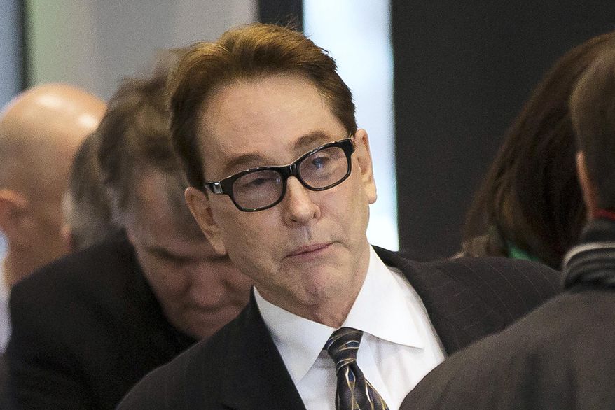FILE - In this Jan. 14, 2014, file photo, H. Ty Warner, the billionaire creator of Beanie Babies, arrives at federal court for sentencing in Chicago. On Friday, July 10, 2015, a federal appeals court upheld the probation sentence for the Warner, rejecting arguments by federal prosecutors that he deserved prison time for hiding millions of dollars in a Swiss bank account. (AP Photo/Andrew A. Nelles, File)